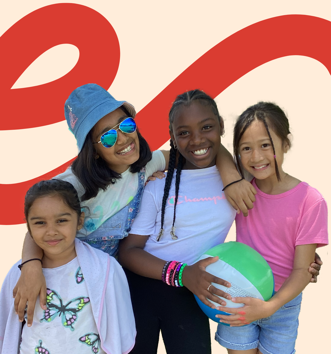 Photo of four LiftED program participants smiling at the camera, with two of the participants holding a beachball together